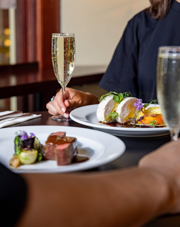 Grand casino dining at restaurant with wine and steak