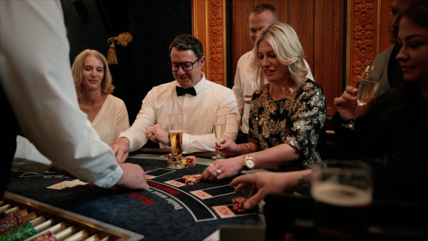 people enjoying casino table games