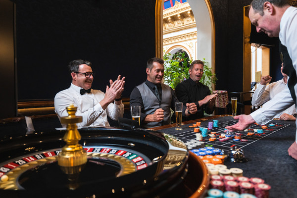 People happy and enjoying their table games